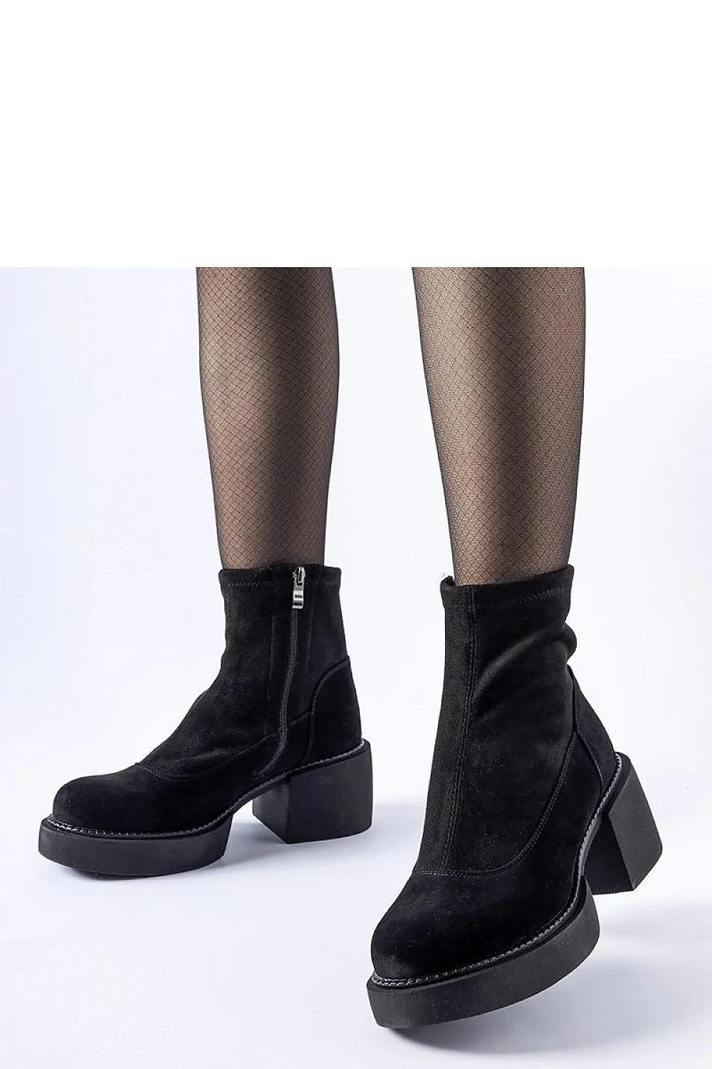Black insulated ankle boots on a massive block
