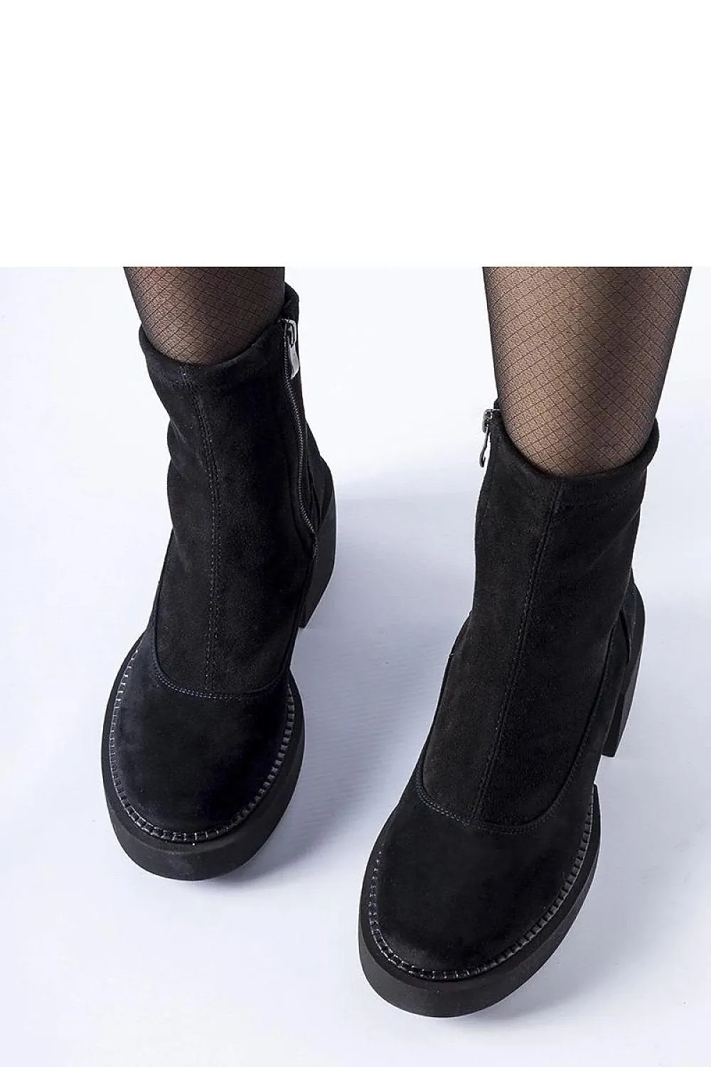Black insulated ankle boots on a massive block